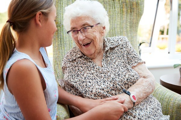 memory-care-young-caregiver-elderly-woman-laughing