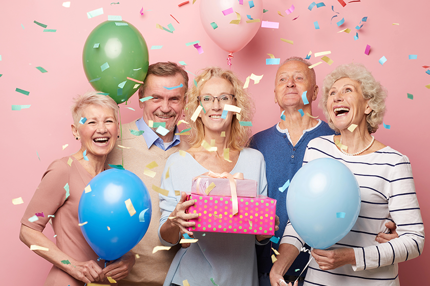 Cheerful excited mature friends in casual outfits