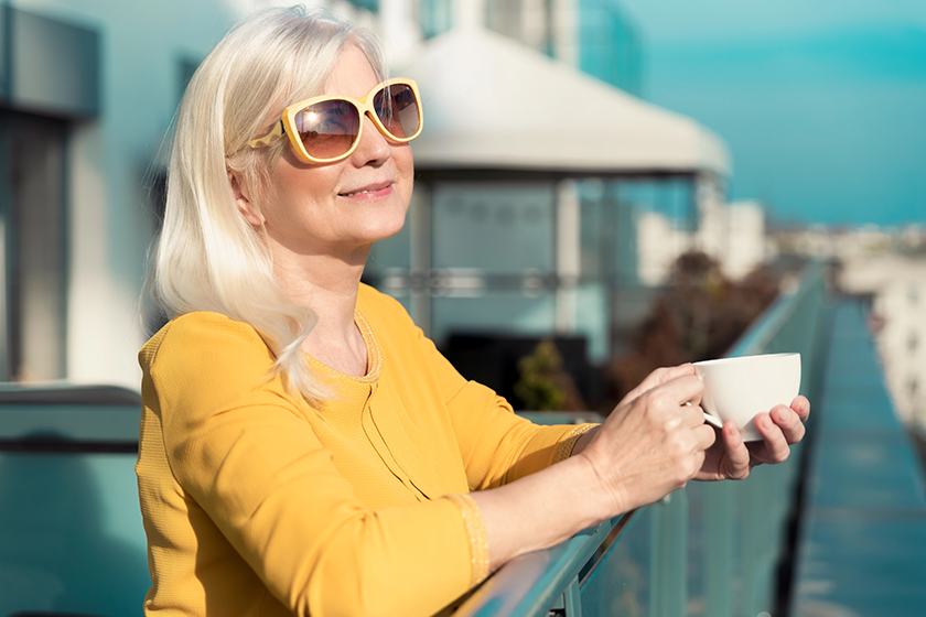 Cheerful woman enjoying sunny day