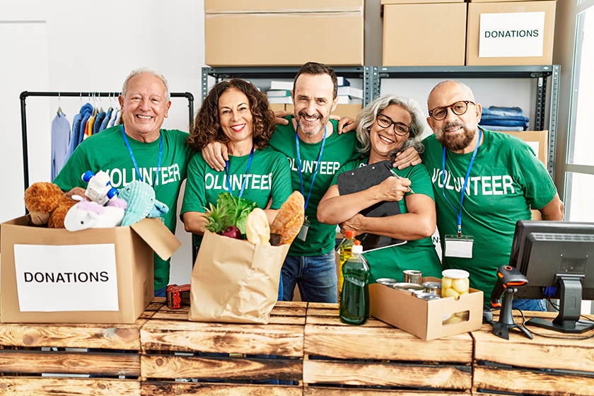 Group of middle age volunteers smiling