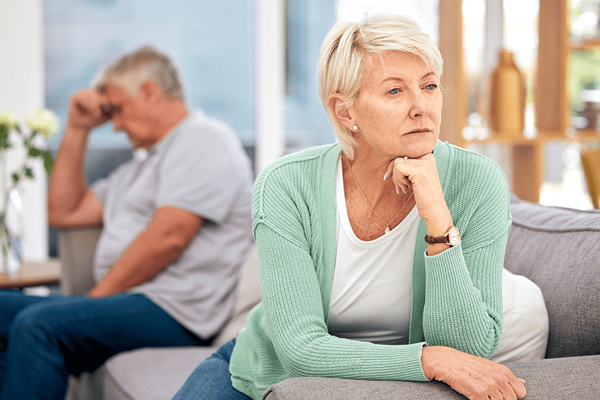 mature couple turning their back on each other due to disagreement